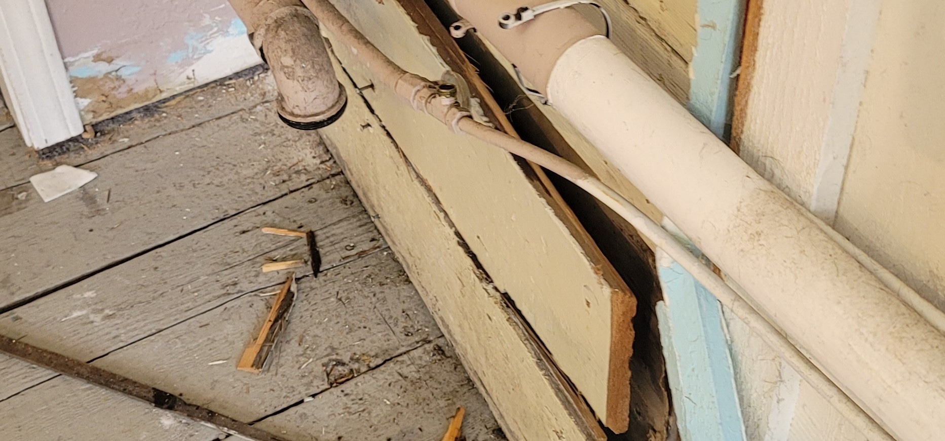 before photo of damaged/unfinished wall